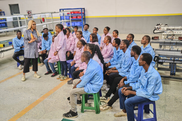 Sandra Chukwudozie, CEO at Salpha Energy holds brief with the workers at Cross River, Nigeria. Salpha produces made-in-Africa solar home systems, and helps households and businesses switch on to clean power, by giving customers access to affordable loans and finance. Credit: Emeke Obanor/Ashden