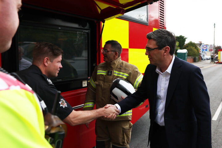 United Kingdom. Prime Minister Andy Burnham with fire service as he visits houses affected by the wildfires in Stourbridge. Picture by Lauren Hurley / No 10 Downing Street