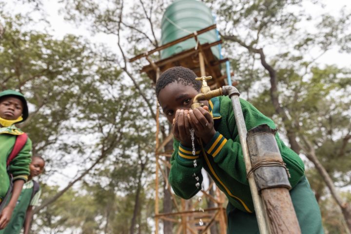 School children drinking from a solar powered water system installed by Zonful Energy | Ashden