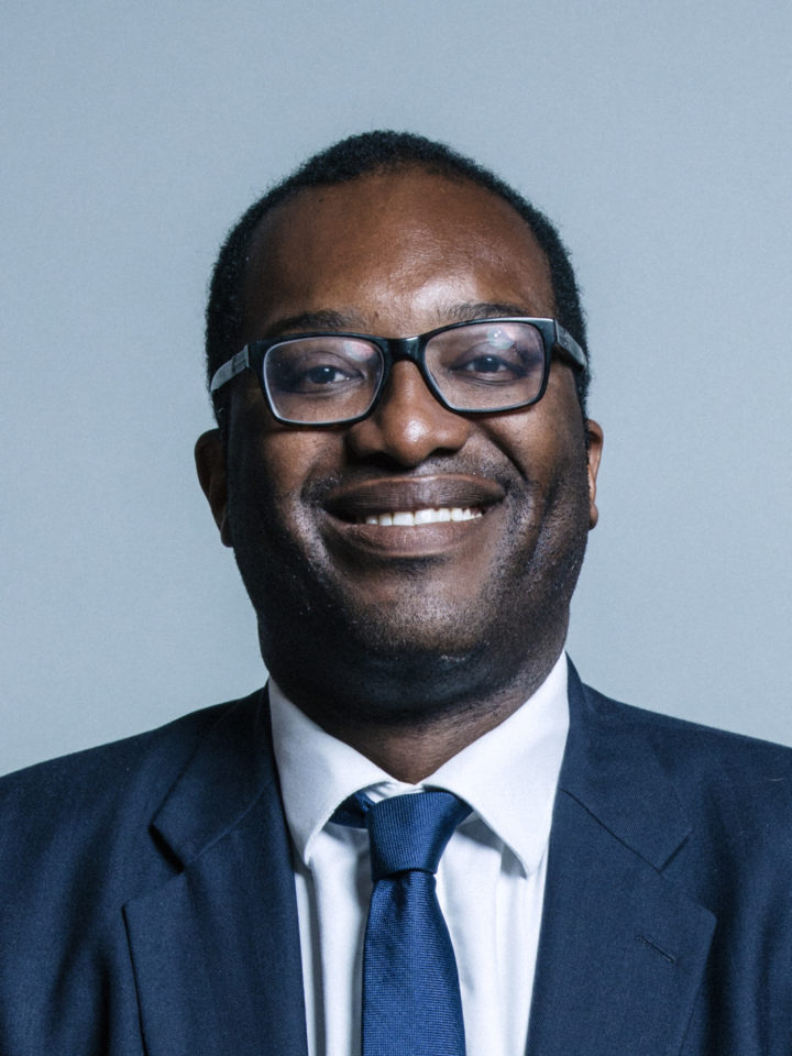 Kwasi Kwarteng MP portrait shows Kwasi smiling wearing a suit and blue tie
